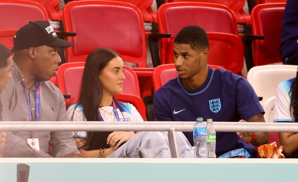 Marcus Rashford and Lucia Loi at a World Cup match.