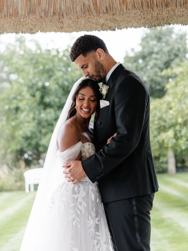 Bride and groom embracing.