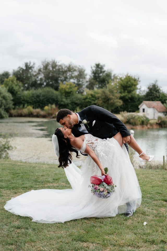 Bride and groom kissing at their wedding.