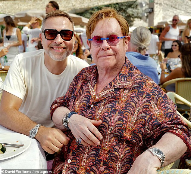 Walliams poses for a photo with his friend Sir Elton at their table at the luxury restaurant