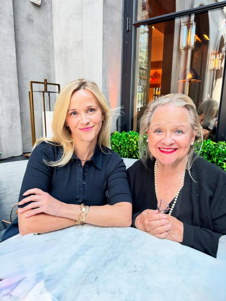 Reese Witherspoon and her mother sitting together at a table.