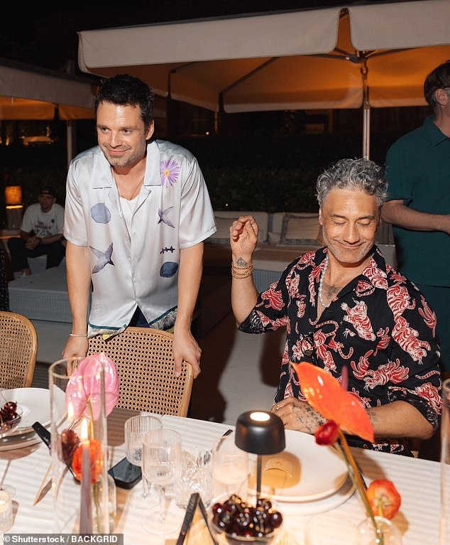 Also in attendance was actor Sebastian Stan who cut a casual figure in a white silk shirt with a floral print