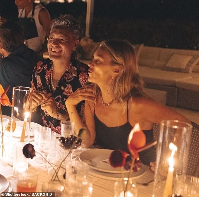 Kate looked in good spirits as she sat alongside Taika while chatting with the other guests