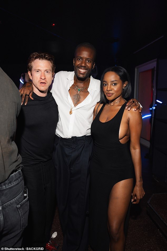 Keisha Buchanan (right) looked incredible in a lack dress with a high leg slit