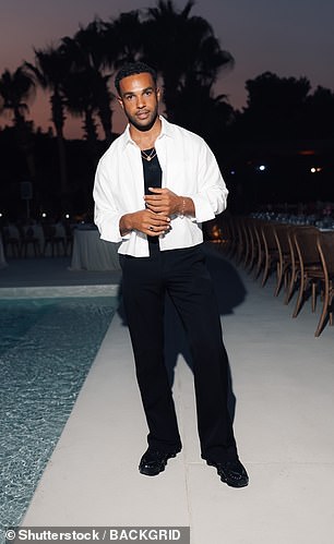 Lucien Laviscount looked dapper in a black vest and matching trousers which he paired with a white shirt