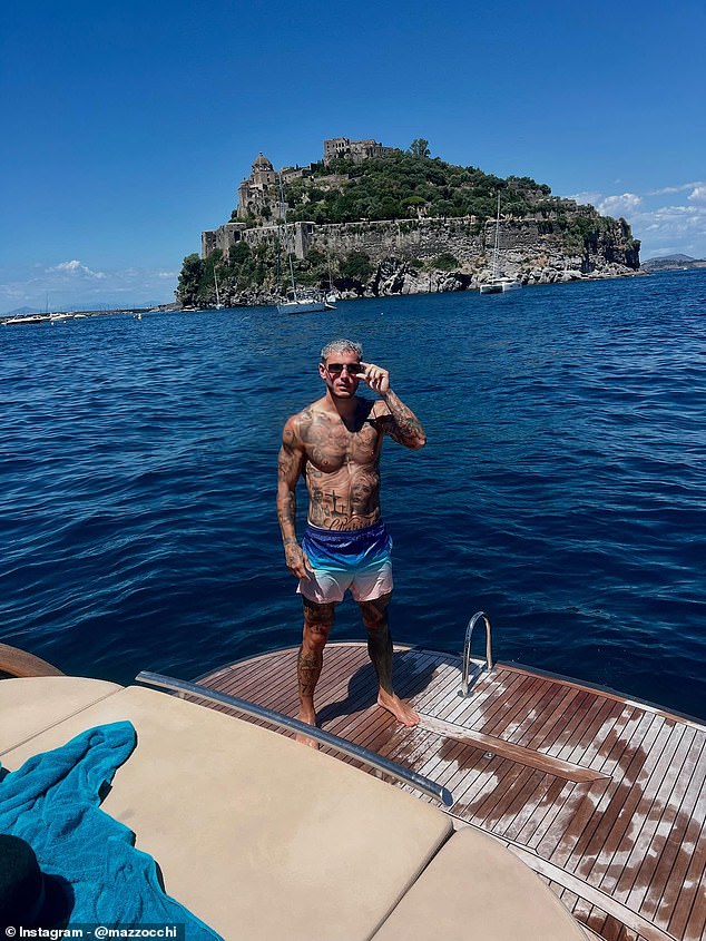 Napoli star Pasquale Mazzocchi enjoys a boat trip out to Ischia's Aragonese Castle