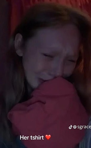 She's seen crying into her mother's clothes, in another video