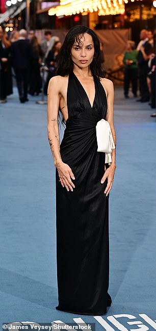 Zoe's gown featured a cream bow and a leggy thigh-high slit