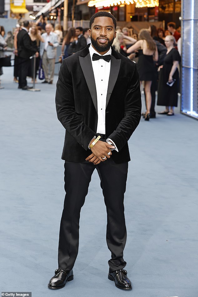 Remell wore a classy velvet tuxedo