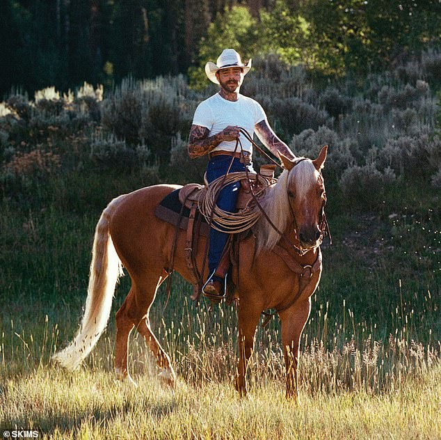 Malone modeled a white T-shirt made of 100-percent cotton and a pair of dark blue jeans in a series of sexy snaps. 'HOTTEST COWBOY,' was another popular comment