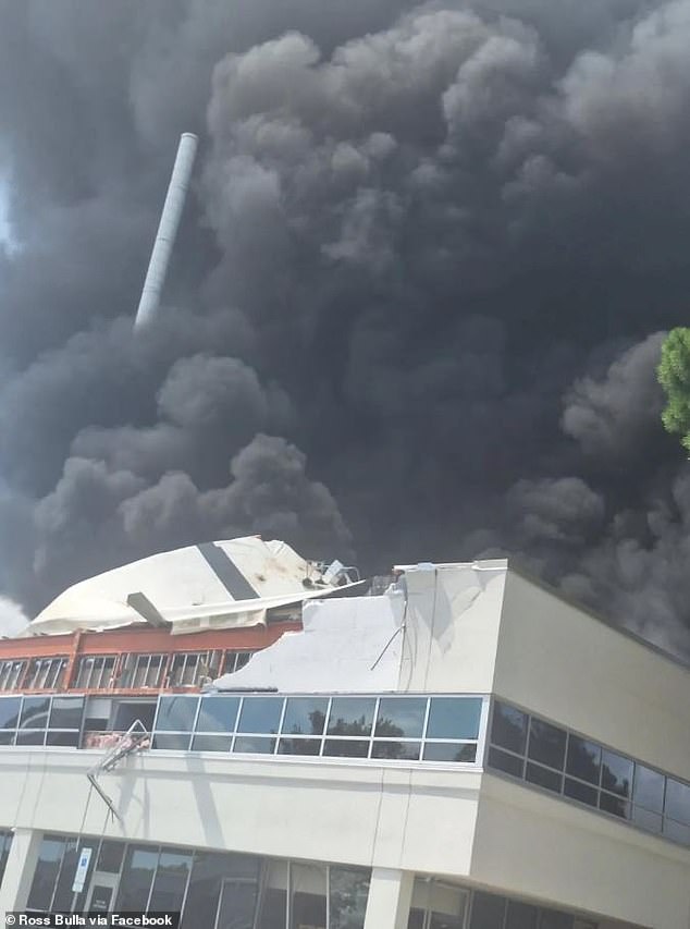 The car hit the gas line to the building on impact, causing an explosion that sent massive clouds of black smoke into the air