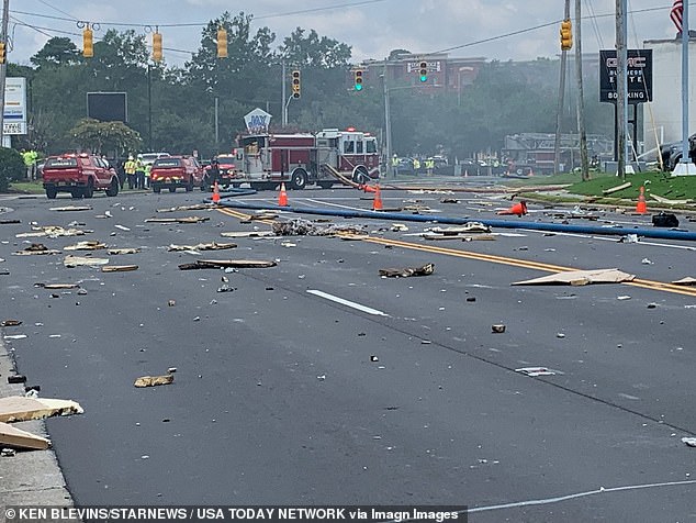 Debris from the building was scattered across the street. The building had been evacuated, but three firefighters were injured while battling the blaze