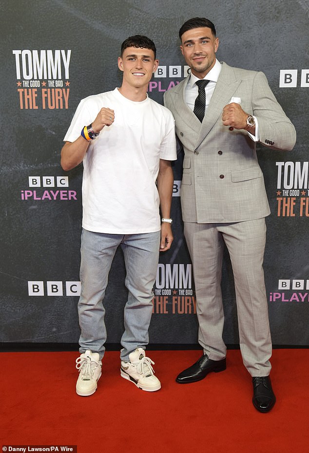 The England star had driven his car into the city centre to attend the premiere of boxer Tommy Fury 's new BBC documentary (pictured with Tommy on the red carpet)