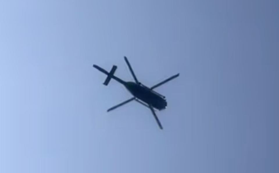Helicopter flying overhead.