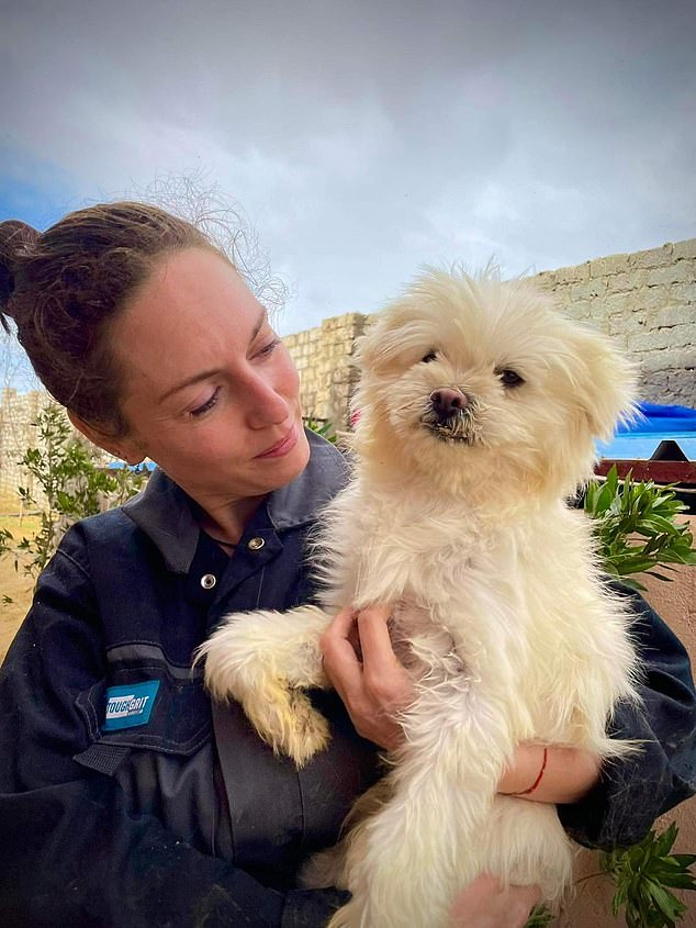 Claire with one of her dogs at the animal sanctuary in Egypt