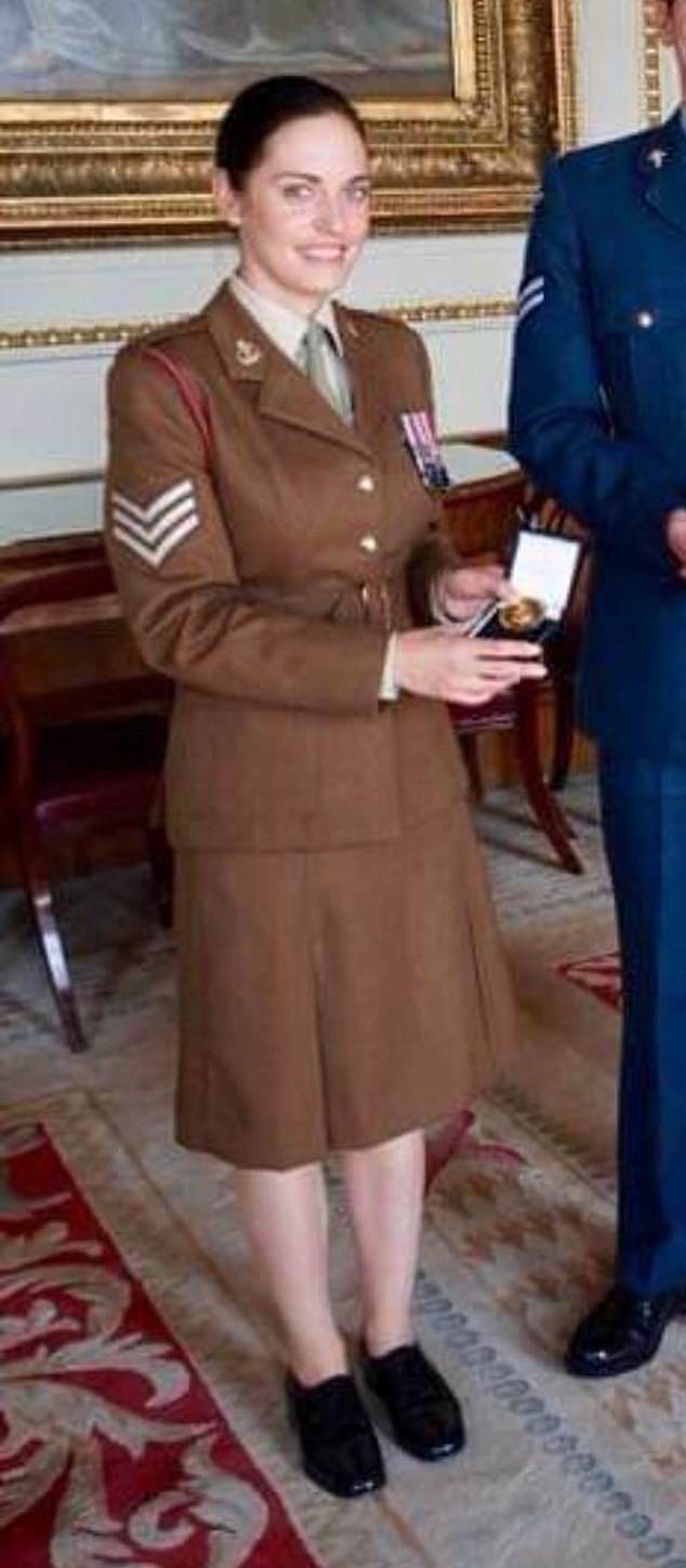 Claire pictured being awarded for her services to the military