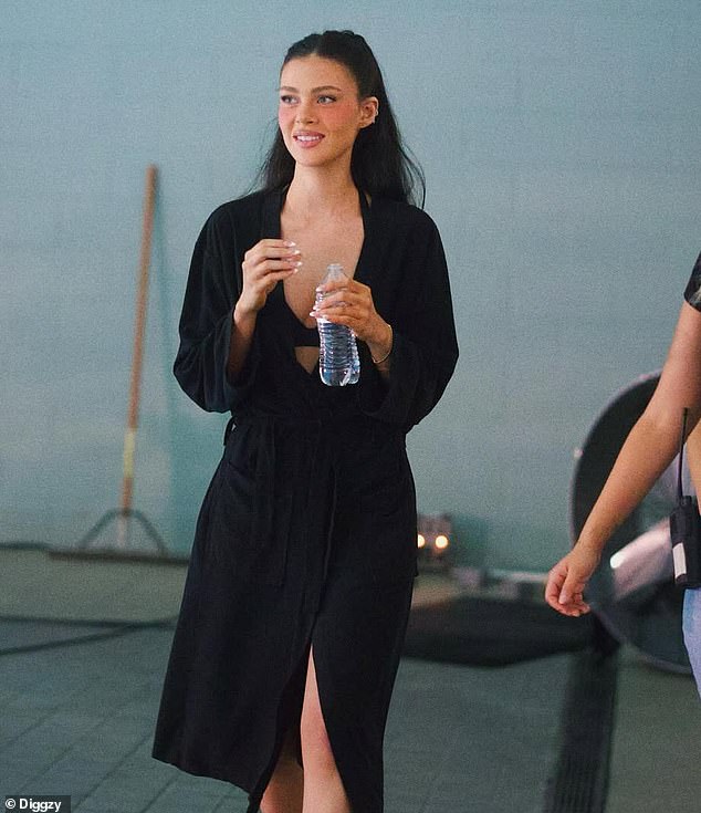 The snaps showed Nicola clad in an eye-catching black crop top, before changing into revealing matching swimwear as she plunged into the pool for a tense scene