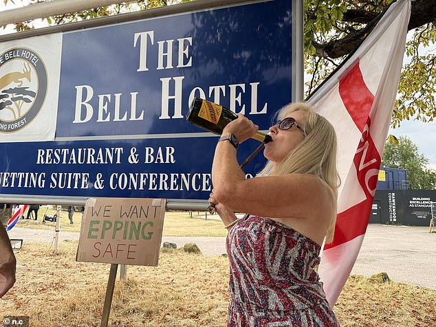 People gather outside The Bell Hotel to celebrate the court's decision on Tuesday