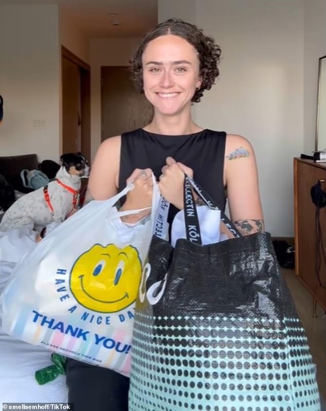 The day before expressing her 'climate anxiety,' Emhoff proudly displayed two bags full of treasures from thrifting - one stuffed inside a plastic 'Have A Nice Day' bag (pictured)
