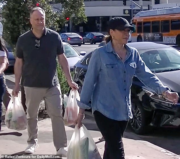 In January, fans expressed outrage after spotting Harris and her husband carrying plastic bags during a grocery store trip (pictured) - again, branding the pair as hypocrites