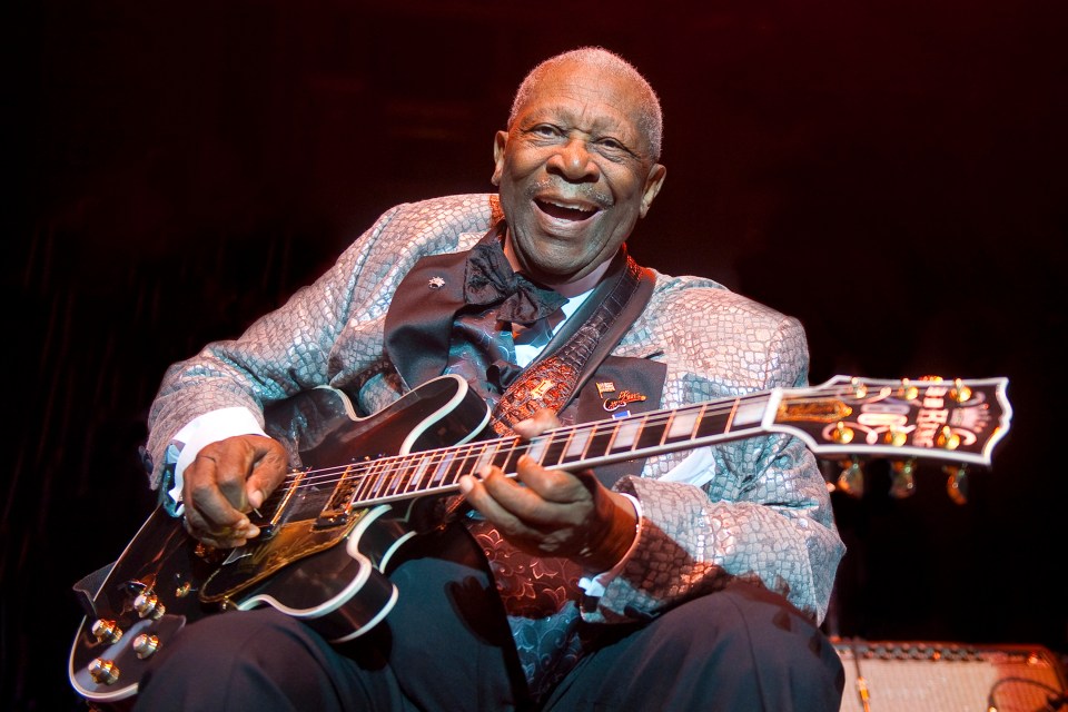 B.B. King performing on stage with his guitar.