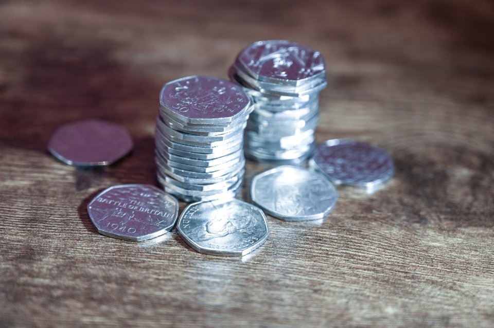 Stacks of 50 pence coins.