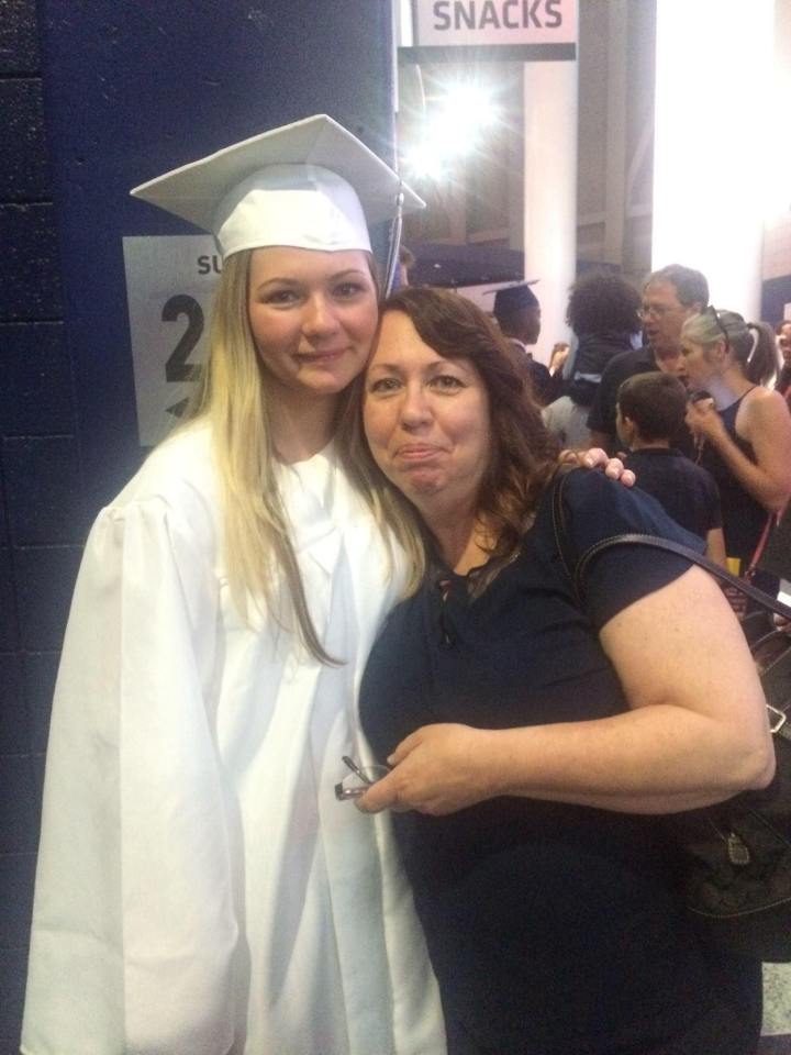 Anjelica Ginter and her sister at a graduation ceremony.