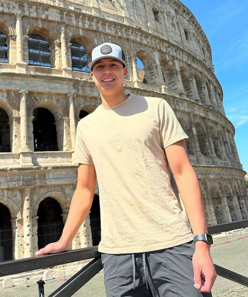 Man in front of the Colosseum.