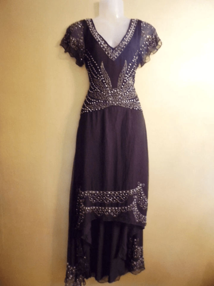 Black beaded maxi dress on a mannequin.