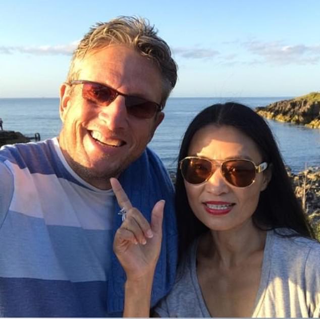 Mr Mercer is in a long-term relationship with Leike Qu (right), with whom he now co-owns Katie's former home