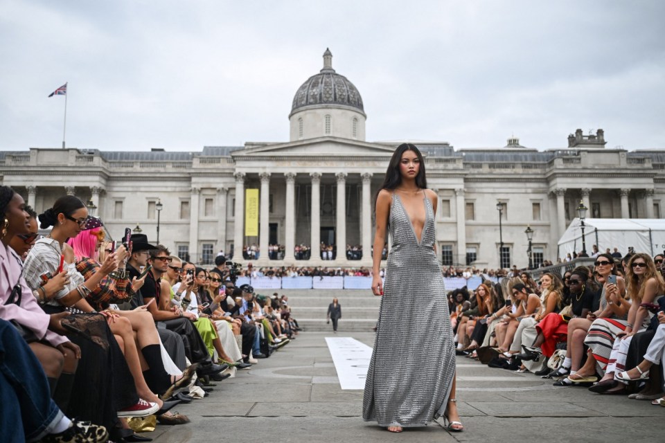 A model presents a creation from the Topshop Topman, Autumn-Winter 2025-2026 runway fashion show collection, at a special presentation in Trafalgar Square, in London, on August 16, 2025. (Photo by Justin TALLIS / AFP) (Photo by JUSTIN TALLIS/AFP via Getty Images)