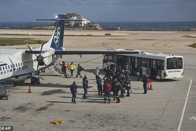 Fire service rescuers arrive at the airport of the earthquake-hit island of Santorini, Greece, on Wednesday, February 5, 2025