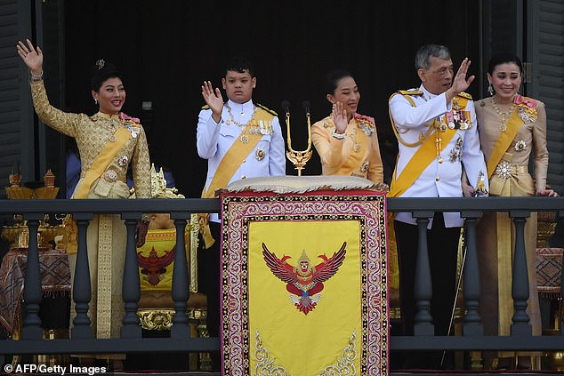 Thailand's King Maha Vajiralongkorn (2nd R) and Queen Suthida (R) wave to well-wishers with his children Princess Sirivannavari Nariratana (L), Prince Dipangkorn Rasmijoti (2nd L) and Princess Bajrakitiyabha Mahidol on May 6, 2019