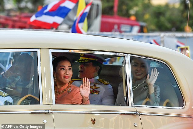 She has been unconscious in hospital since falling ill due to heart problems in December 2022 during a dog training session. Pictured: Thailand's King Maha Vajiralongkorn (C), Queen Suthida (R) and Princess Bajrakitiyabha Mahidol (2nd L) wave to supporters on arrival at the Grand Palace in Bangkok on November 1, 2020