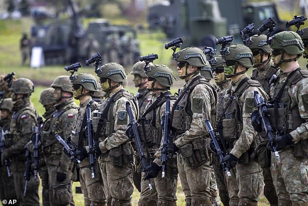 Lithuanian Army soldiers take part in a Lithuanian-Polish Brave Griffin 24/II military exercise near the Suwalki Gap near the Polish border at the Dirmiskes village, in Lithuania on Friday, April 26, 2024