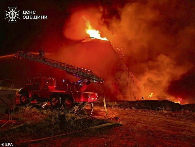 Ukrainian rescuers working at the site of a Russian strike on an infrastructure facility near Odesa, Ukraine, 18 August 2025