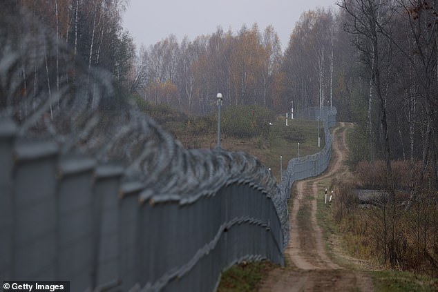 A Lithuanian border fence runs along the bborder to the Russian semi-exclave of Kaliningrad on October 28, 2022 near Vistytis, Lithuania