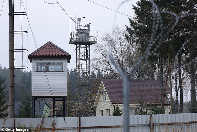 Observation towers stand behind barbed wire on the Russian side of the border between the Russian semi-exclave of Kaliningrad and Lithuania