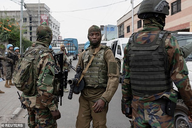 Pictured: Members of the M23 rebel group supervise the exit of mercenary troops in the streets of Goma amid conflict between them and the Armed Forces of the Democratic Republic of the Congo (FARDC), in Goma, eastern Democratic Republic of the Congo, January 29, 2025