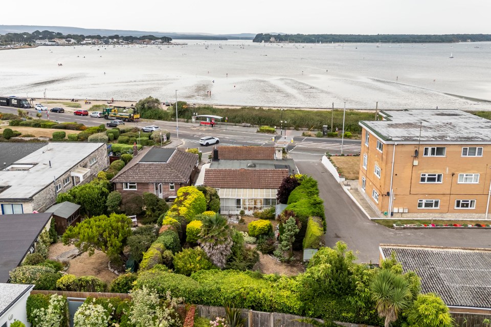 Aerial view of a bungalow in Sandbanks with harbor views.