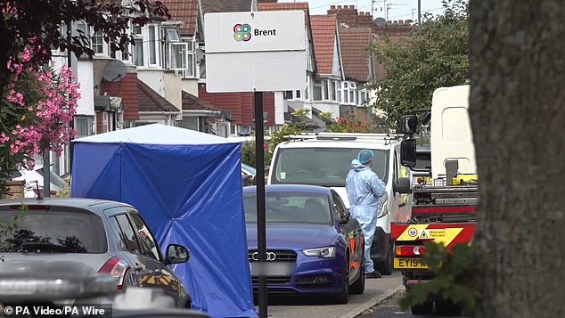 A blue forensics tent has been erected on the street following the stabbing on Tuesday