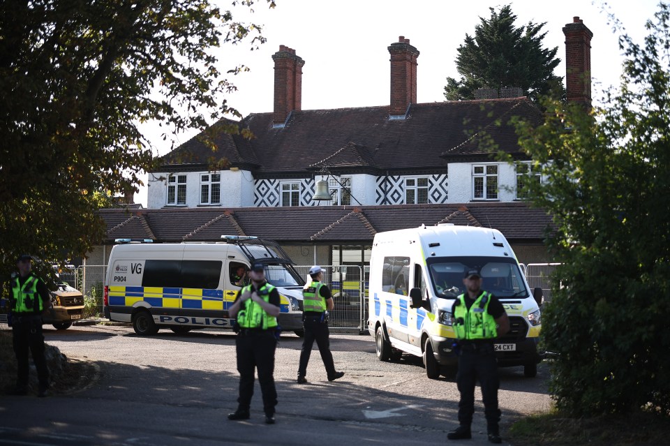 (FILES) Police officers stand outside the The Bell Hotel, believed to be housing asylum seekers, in Epping, northeast of London, on August 8, 2025, as protests are expected from far right groups. A UK judge on Tuesday, August 19, blocked asylum seekers from being housed at a hotel in a town which has witnessed violent protests, dealing a blow to the government. (Photo by HENRY NICHOLLS / AFP) (Photo by HENRY NICHOLLS/AFP via Getty Images)