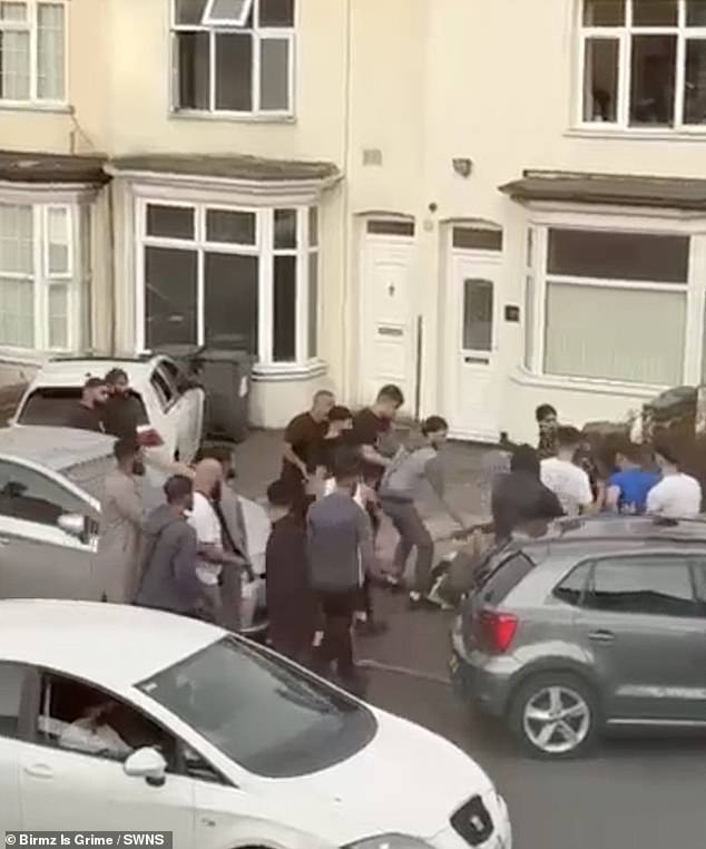 At one point, a man falls to the ground and is surrounded by rivals raining kicks and punches on him