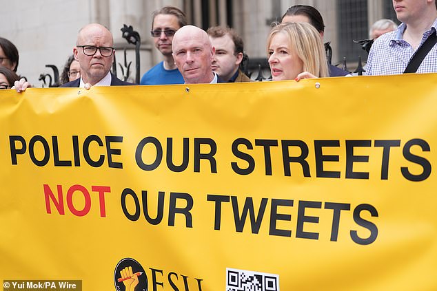Raymond Connolly (centre) with supporters outside the Court of Appeal at the Royal Courts of Justice in central London