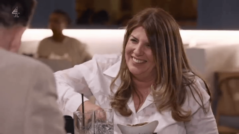 Woman laughing on a date.