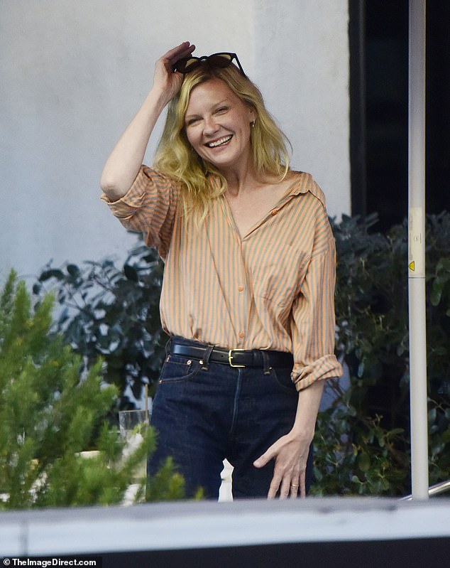 The actress sported a striped button-up blouse tucked into a pair of dark jeans with a black belt
