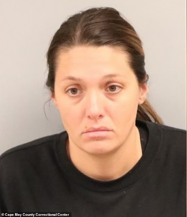 Caron pictured after her arrest in January. She remains suspended from Middle Township Elementary School, where she worked as a fifth grade teacher