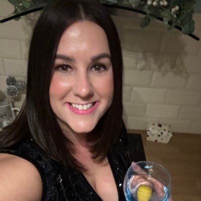 Photo of Lucie Connolly holding a cocktail.