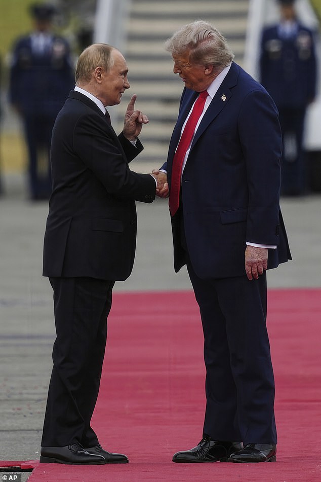 President Donald Trump greets Russia's President Vladimir Putin on the tarmac at Joint Base Elmendorf-Richardson in Anchorage, Alaska, Aug. 15, 2025