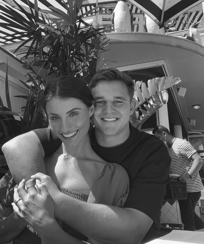 Black and white photo of a couple embracing.